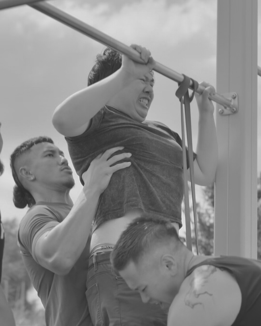 Brotherhood members lifting together in the gym
